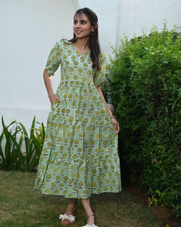 Woman wearing light green floral printed cotton Anarkali maxi dress with puff sleeves