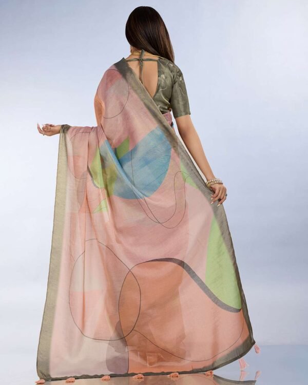 Teal green and mauve pink linen saree with geometric patterns and floral printed pallu