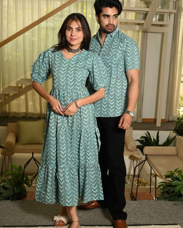Couple wearing matching sage green cotton dress and shirt with arrow print