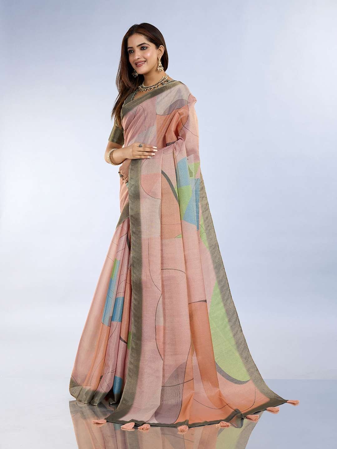 Teal green and mauve pink linen saree with geometric patterns and floral printed pallu