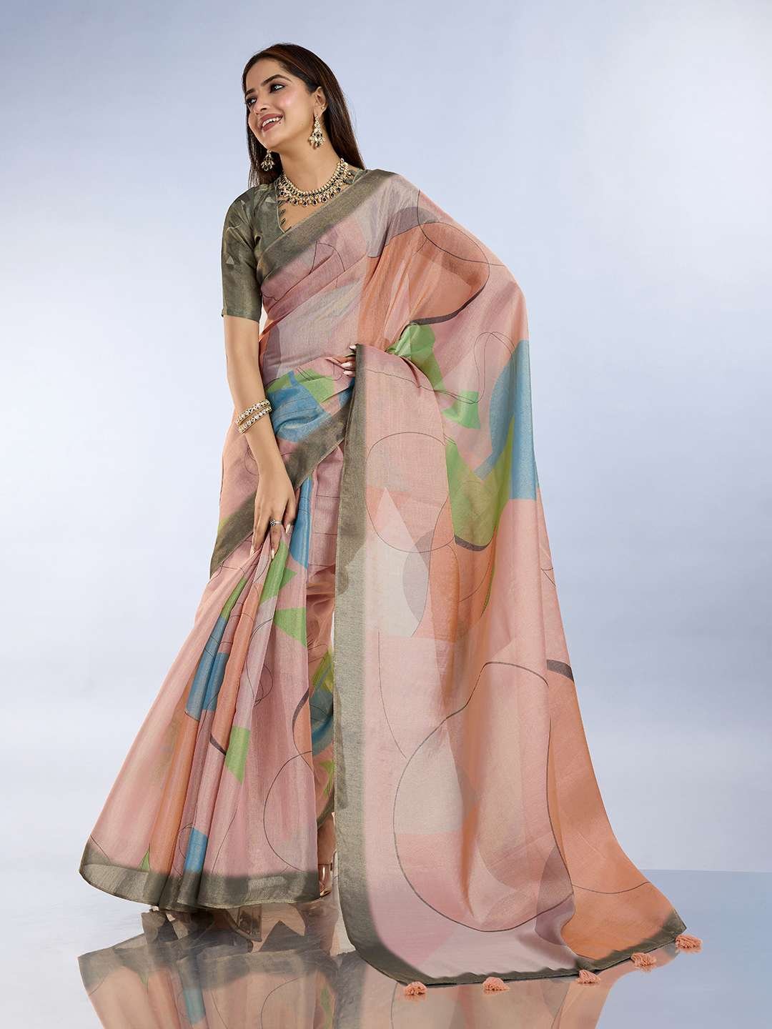 Teal green and mauve pink linen saree with geometric patterns and floral printed pallu